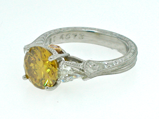 A 2.36-carat round yellow diamond set in a platinum ring with 18-karat yellow gold accents, est. $25,000-$27,000. Image courtesy of Morton Kuehnert Auctioneers.